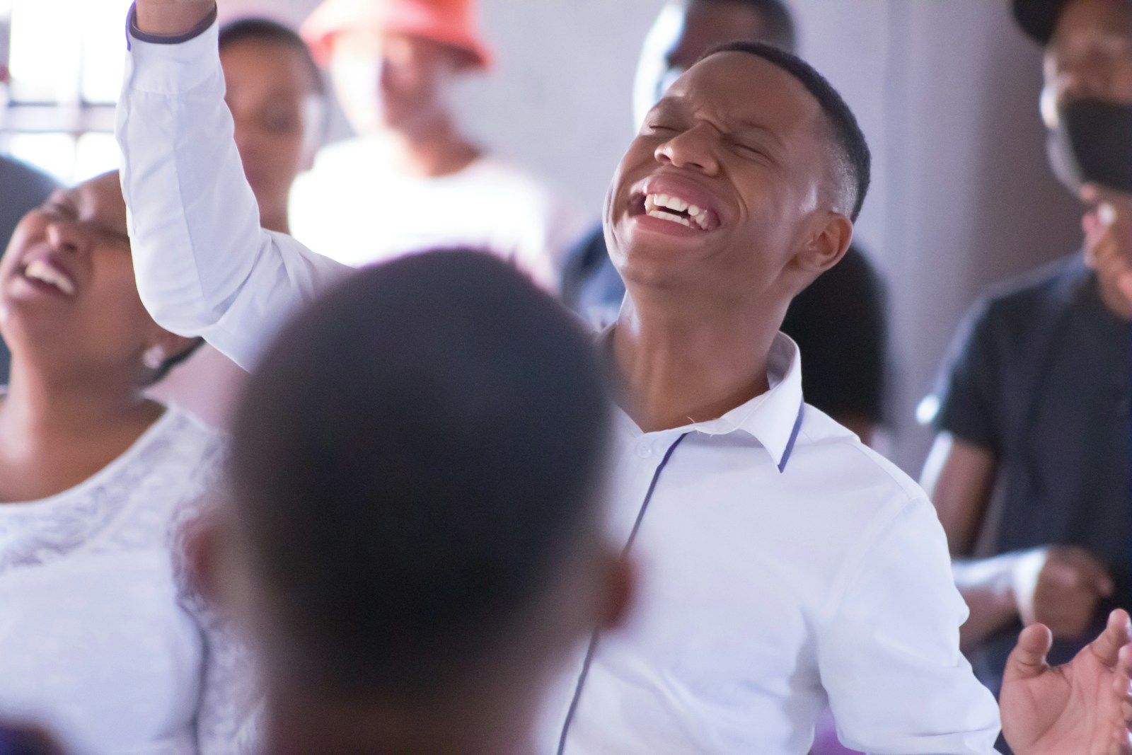 smiling man in white dress shirt